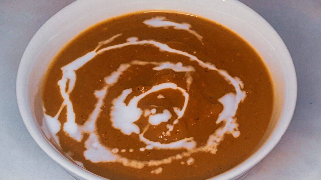 Roasted vegetable soup in a bowl.