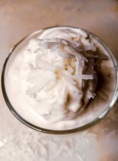 jelly coconut ice cream in a glass with shredded coconut