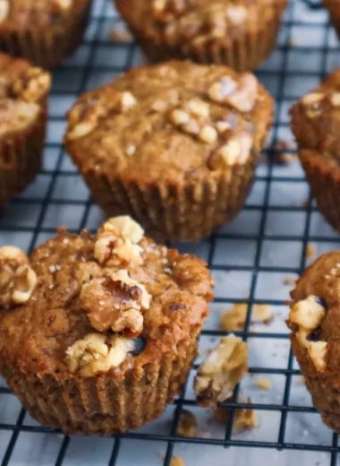 Banana nut muffins on a cooling rack.