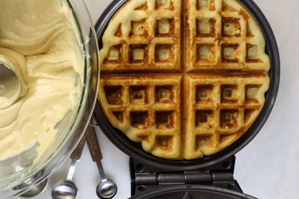 Gluten-free waffle on a waffle iron.