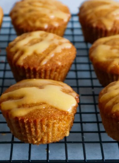 Gluten-free mango muffins on a cooling rack.