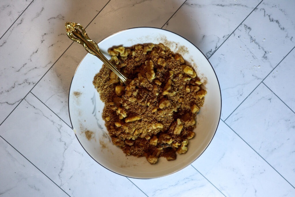 Mixing the topping ingredients in a small bowl.