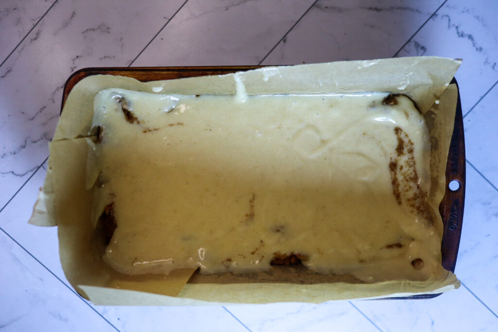 Pouring the batter on top of the topping.