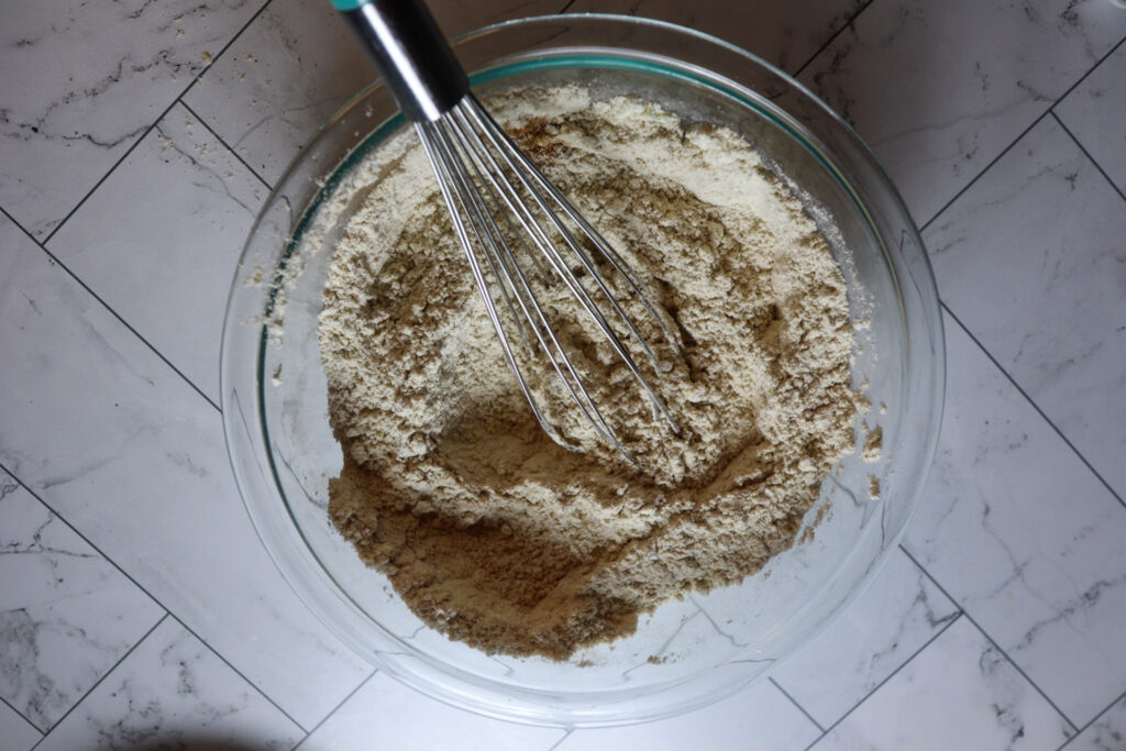 Whisking the dry ingredients in a bowl.
