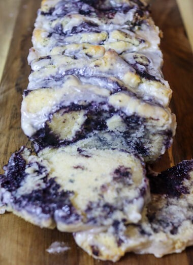 Blueberry butter pull apart bread on a cutting board.