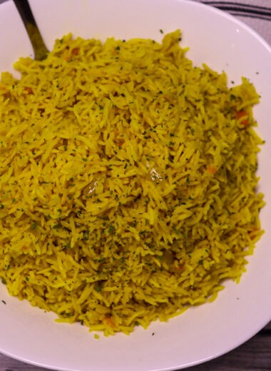 Yellow rice in a serving bowl.