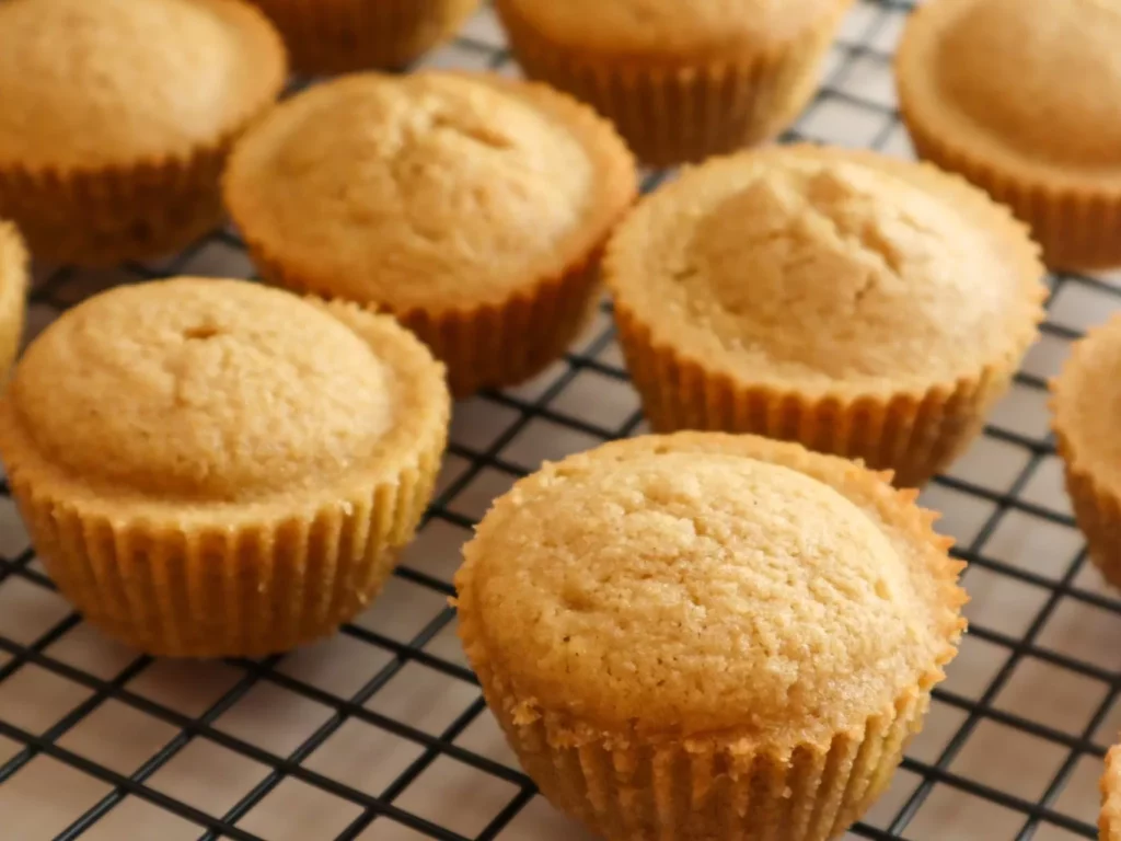 Maple cornbread muffins gluten-free on a cooling rack.