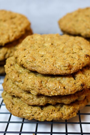 Gluten-free oatmeal cookies on a cooling rack.