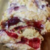 Gluten-free cranberry jam pull-apart bread on a cutting board.