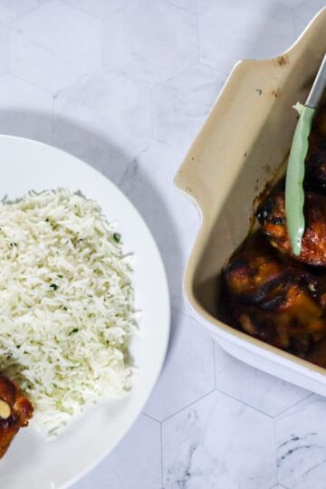 Crispy BBQ chicken with Alabama white BBQ sauce servedwith parsley rice and mixed vegetables.