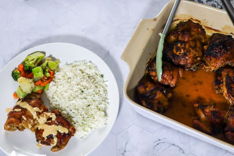 Crispy BBQ chicken with Alabama white BBQ sauce servedwith parsley rice and mixed vegetables.