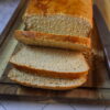 Gluten-free mashed potato bread on a cutting board.