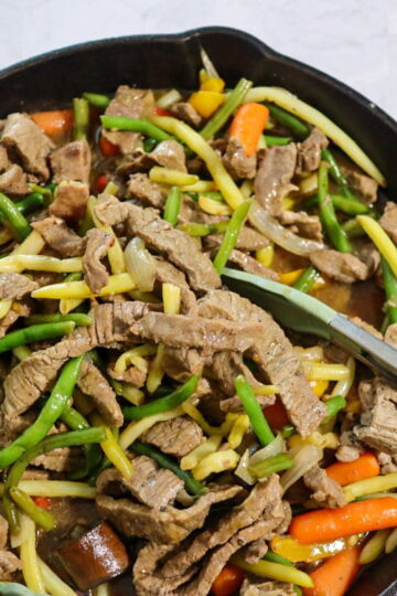 Beef stir-fry in a skillet.